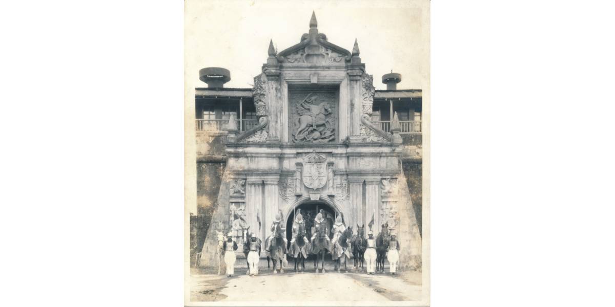 Participants of the Manila Carnival posing in front of the Fort Santiago gate, 1932
